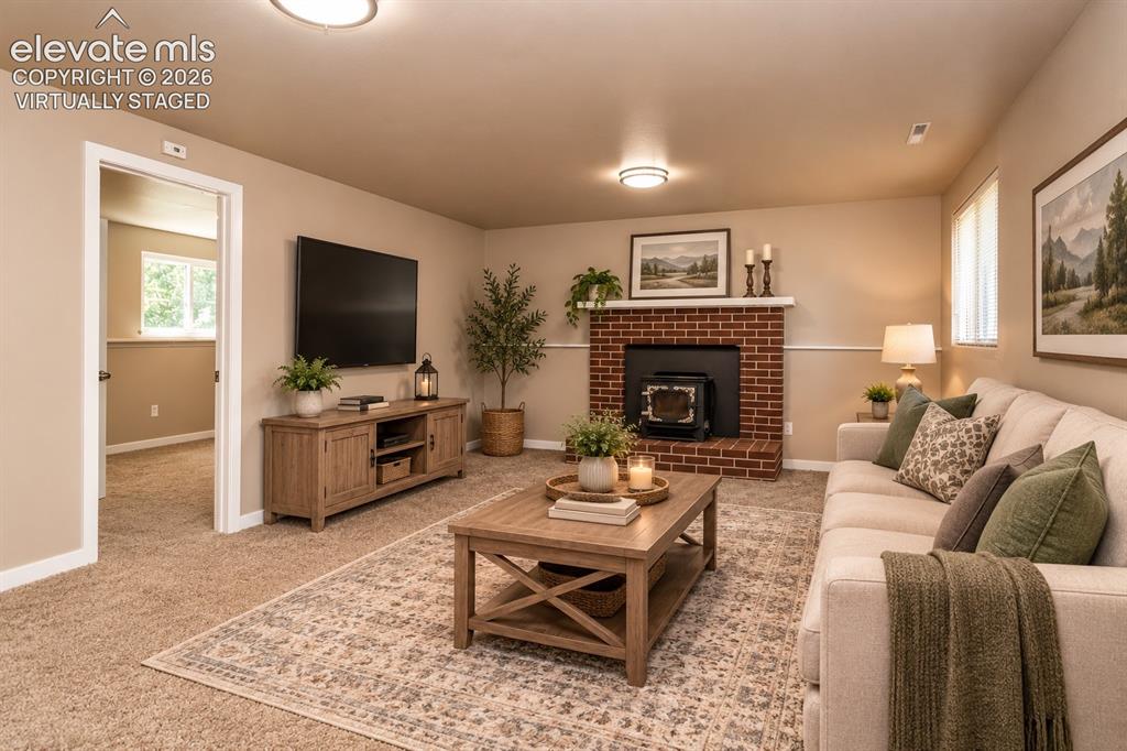 Image 26 of 46: Virtually staged lower level family room