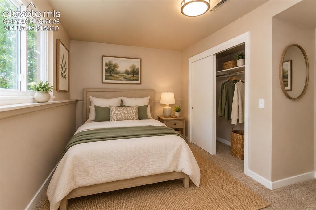 Image 29 of 46: Virtually staged lower level bedroom