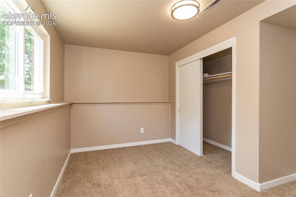 Image 30 of 46: Lower level bedroom