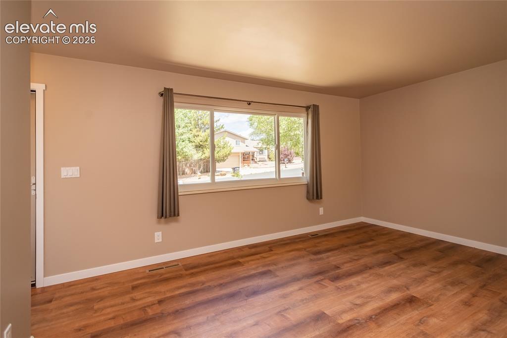 Image 7 of 46: Living room with fresh paint