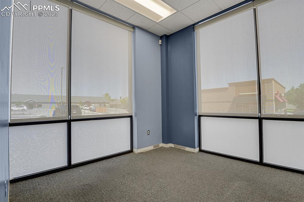 Image 18 of 50: Carpeted empty room with baseboards