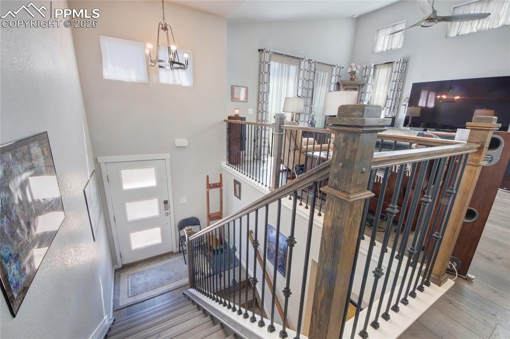 Image 12 of 25: Foyer with wrought iron railing