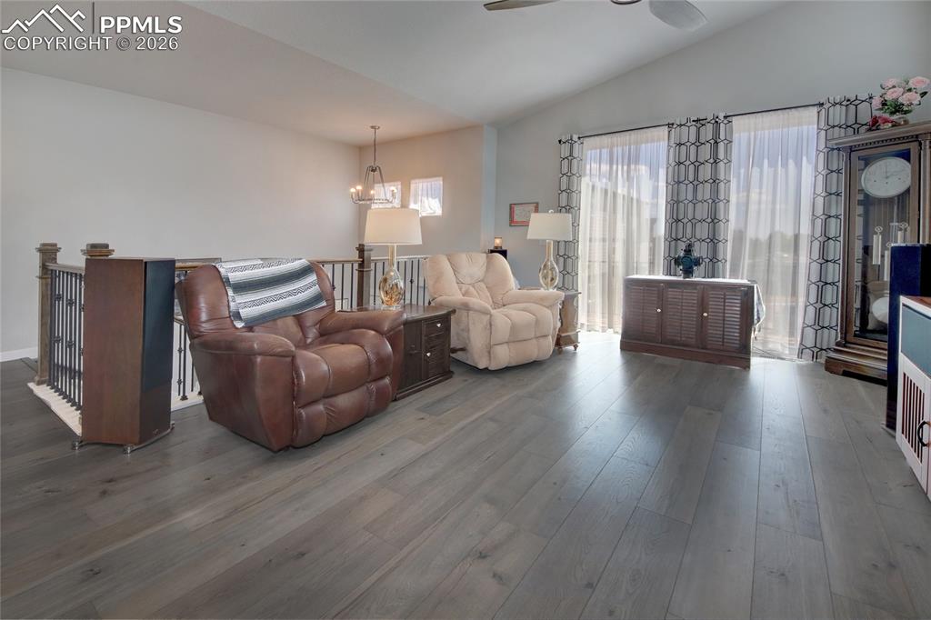 Image 16 of 25: Living room walks out to balcony