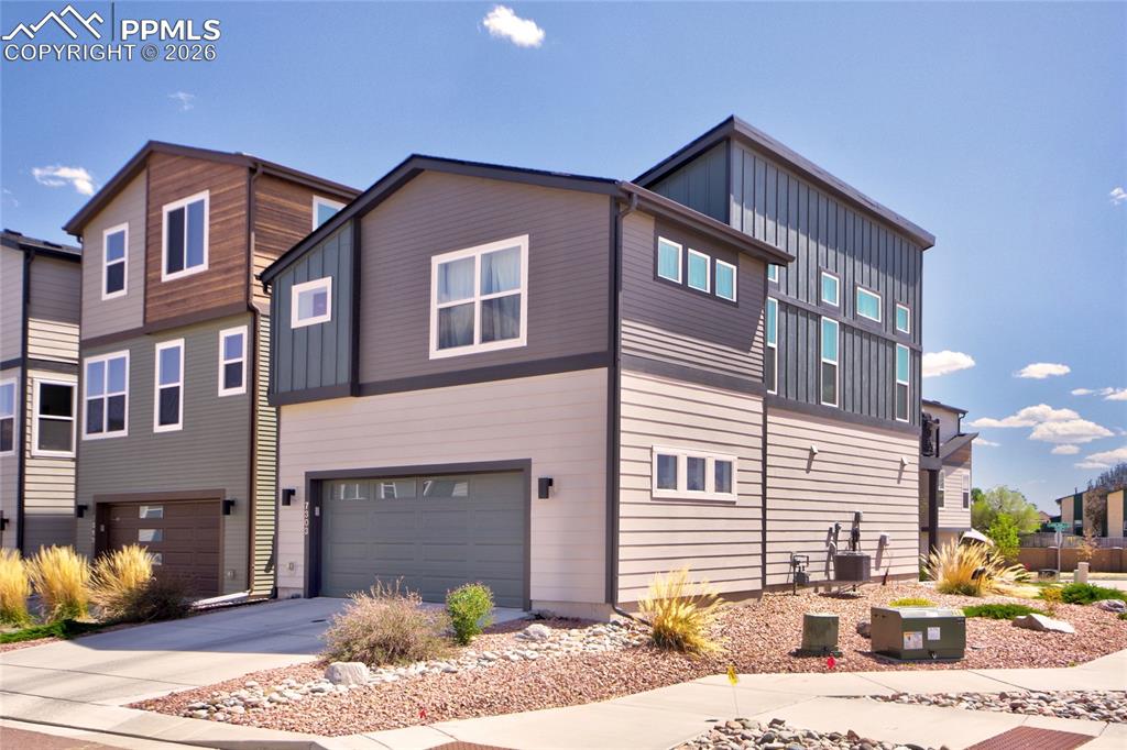 Image 22 of 25: 2 car attached garage with ev charging