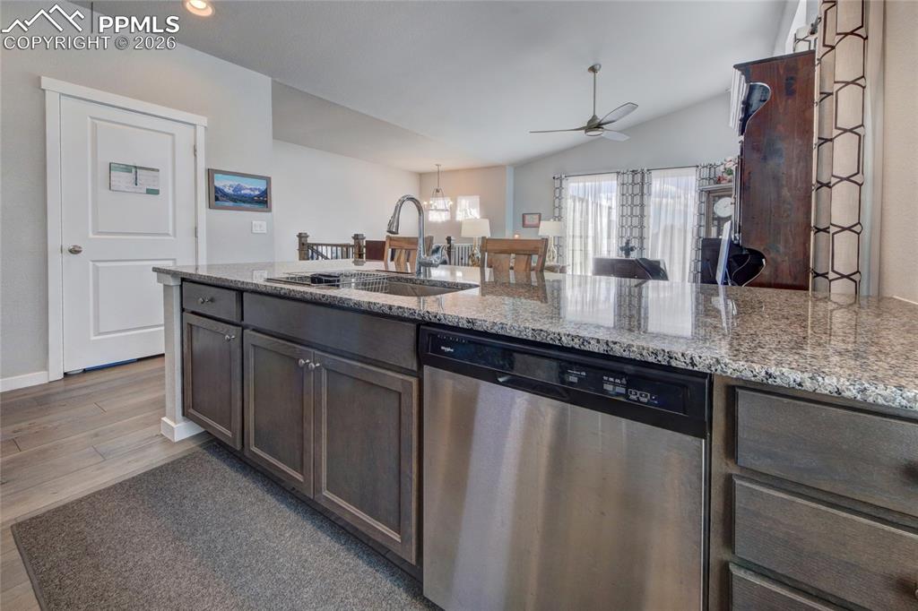 Image 9 of 25: Kitchen with oak cabinetry and ss appliances