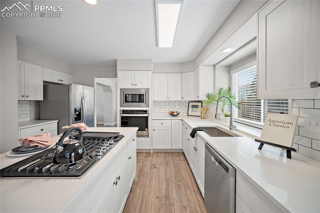 Image 13 of 46: Plenty of counter and cabinet space. 
