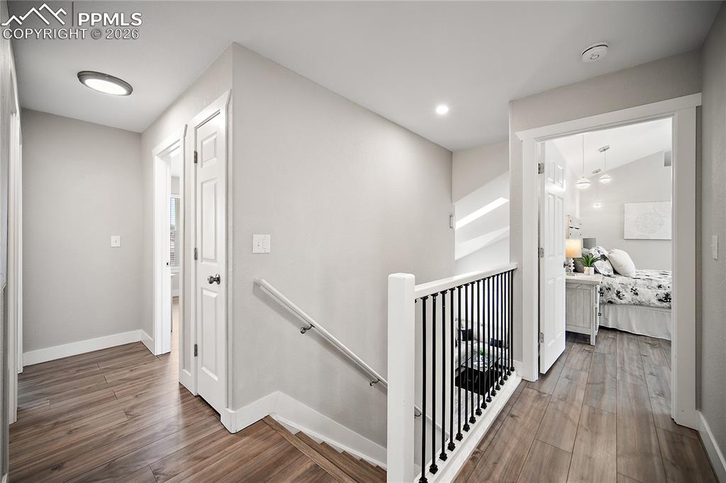 Image 21 of 46: Laminate flooring continues upstairs. 
