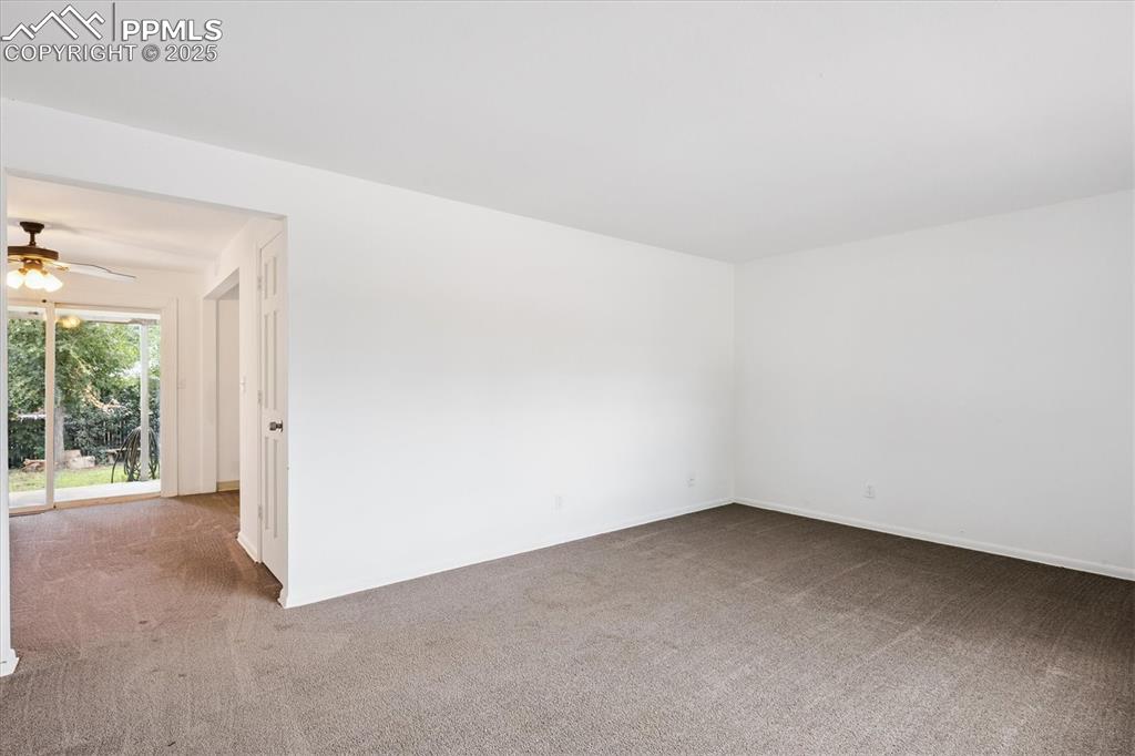 Image 3 of 19: Spare room featuring carpet flooring and ceiling fan