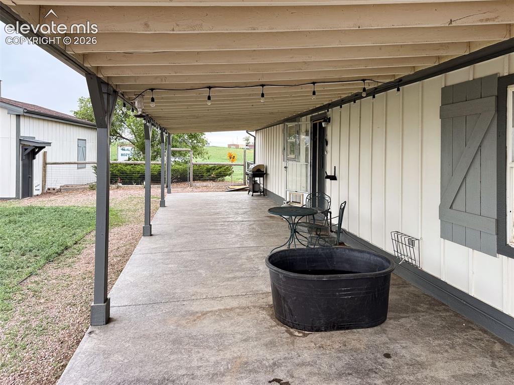 Image 23 of 42: Rear covered patio 