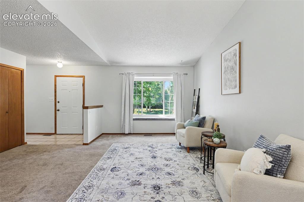 Image 11 of 41: Looking back on front entry and picture window