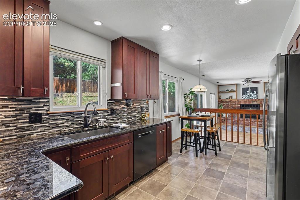 Image 16 of 41: Walking in the kitchen from designated dining area