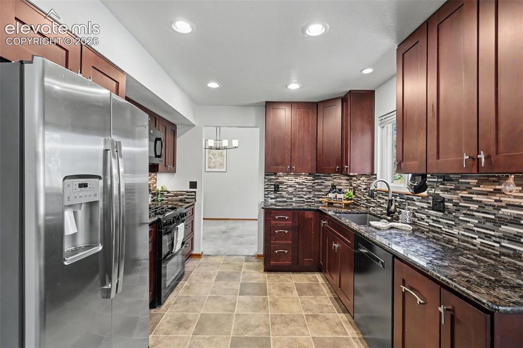 Image 18 of 41: Kitchen looking back towards designated dining area