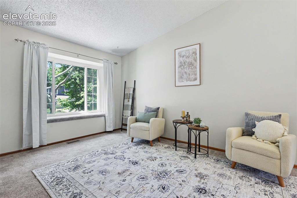 Image 7 of 41: Living area with picture window & nook 