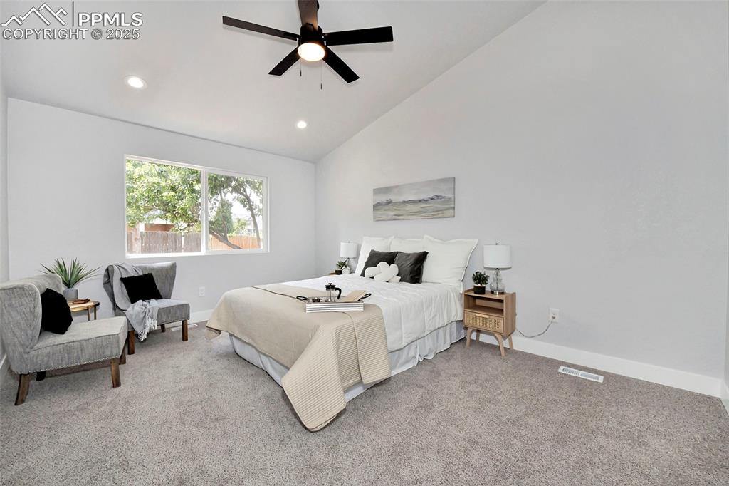 Image 14 of 44: Bedroom featuring recessed lighting, carpet, a ceiling fan, and high vaulte