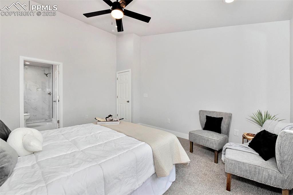 Image 15 of 44: Carpeted bedroom with recessed lighting, connected bathroom, and a ceiling 