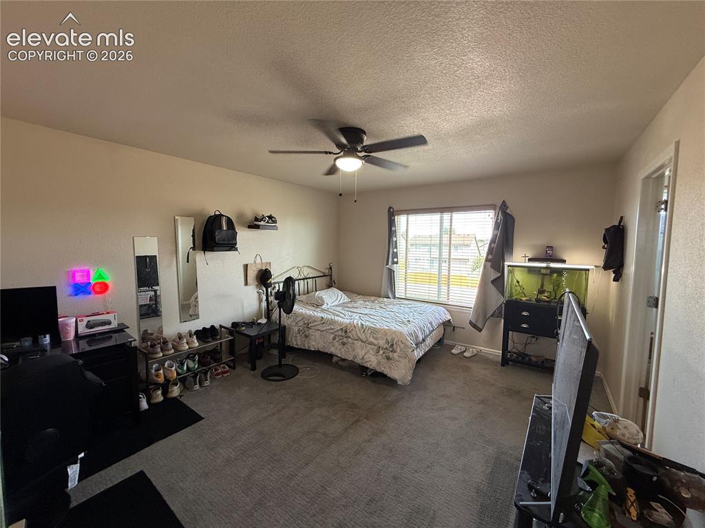 Image 13 of 16: Recessed window with horizontal blinds, overhead ceiling fan with lighting,