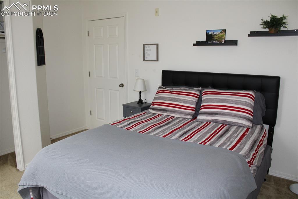 Image 16 of 20: Bedroom featuring carpet floors