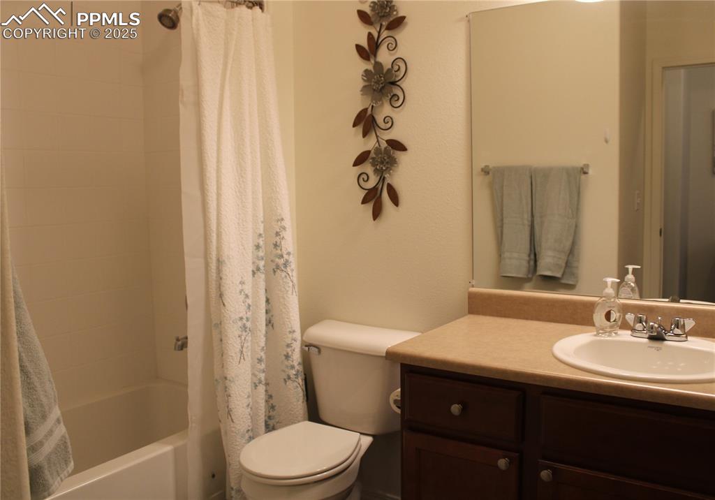 Image 18 of 20: Bathroom featuring vanity and shower / tub combo