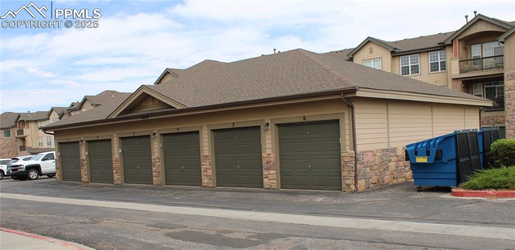 Image 6 of 20: Garage featuring a residential view