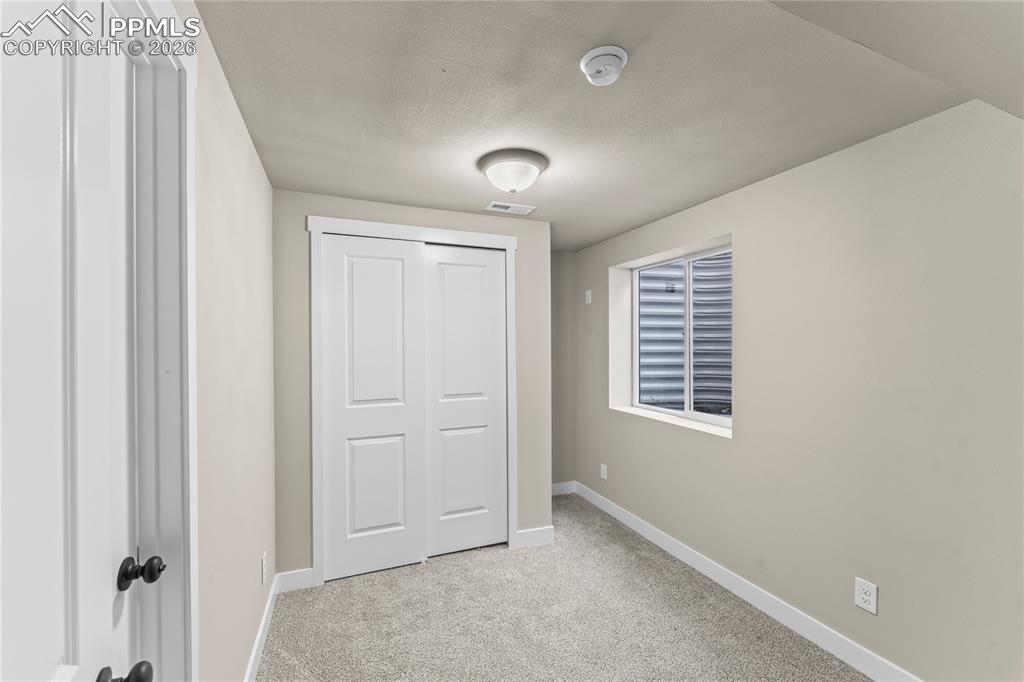 Image 28 of 29: Basement Guest Bedroom