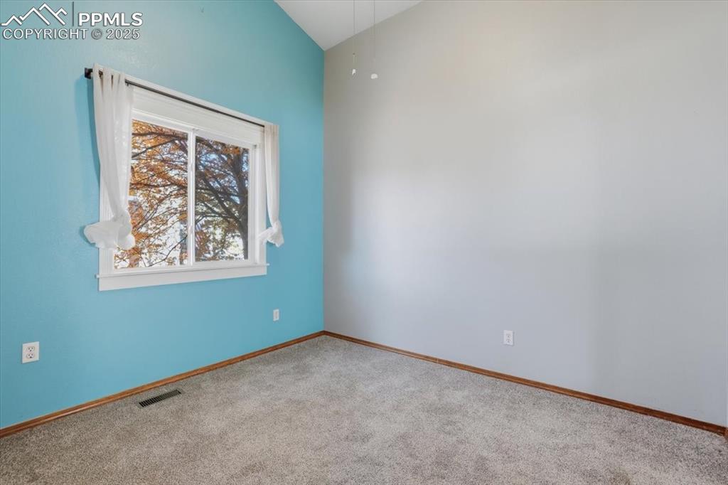 Image 16 of 43: Carpeted empty room with baseboards