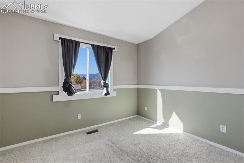 Image 19 of 43: Carpeted empty room with baseboards