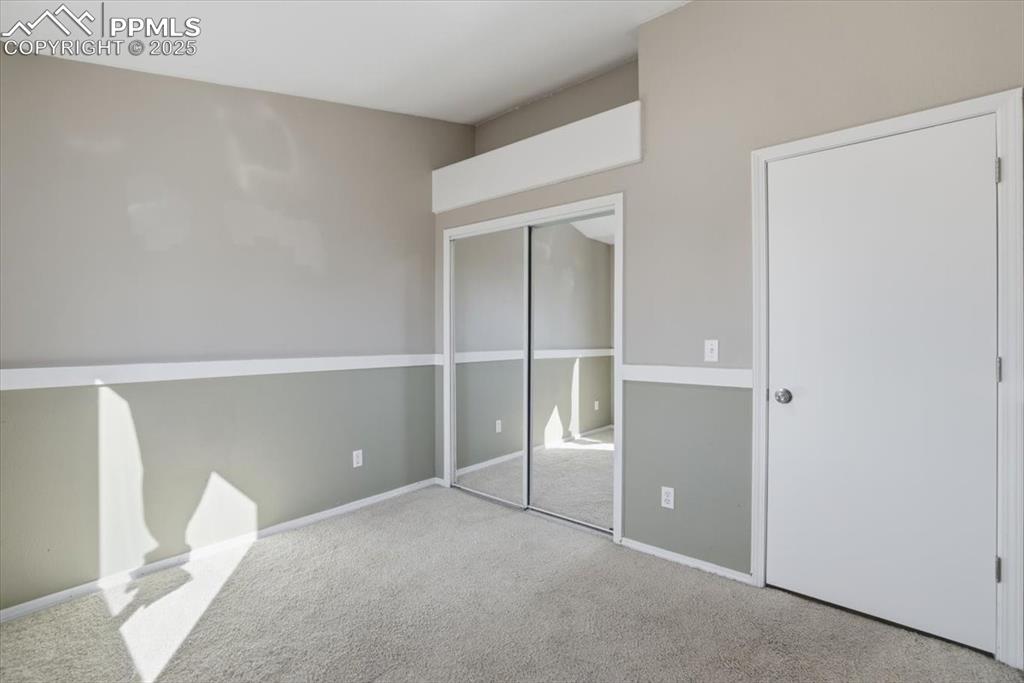 Image 20 of 43: Unfurnished bedroom with carpet floors and a closet