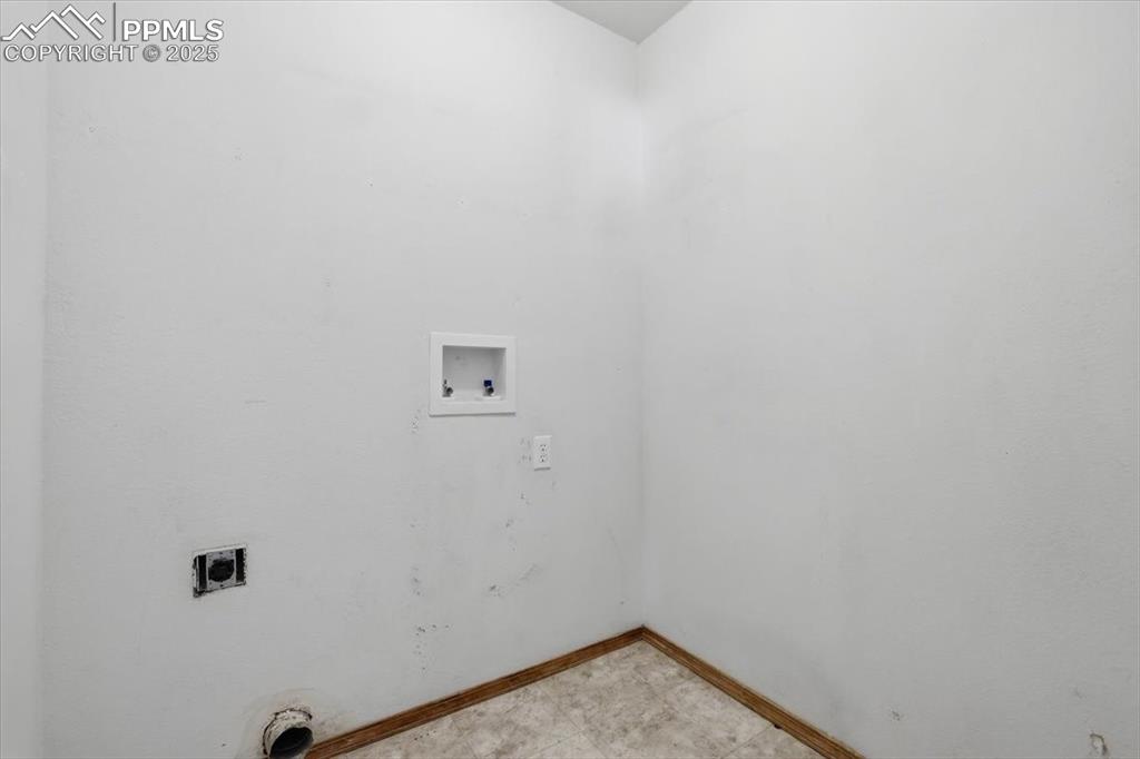 Image 22 of 43: Laundry room with hookup for an electric dryer and hookup for a washing mac