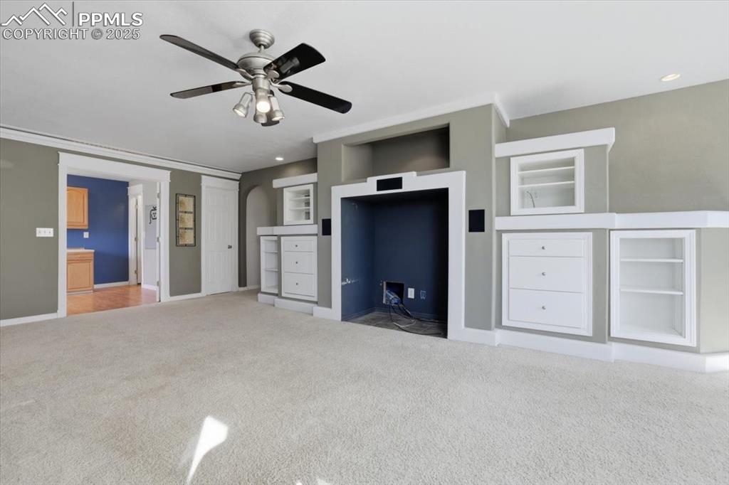 Image 27 of 43: Unfurnished bedroom featuring carpet floors, a closet, a ceiling fan, and r