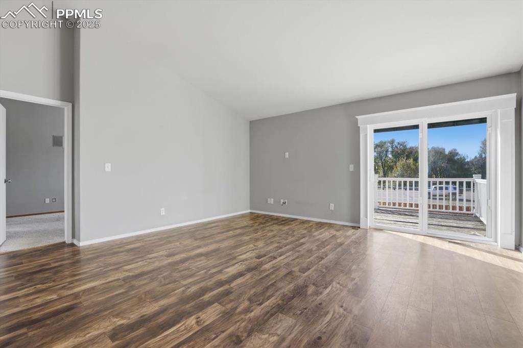 Image 8 of 43: Unfurnished room featuring wood finished floors and baseboards