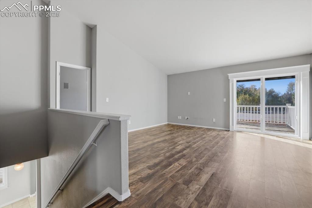 Image 9 of 43: Spare room with wood finished floors and baseboards