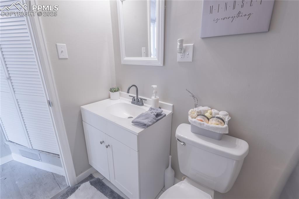 Image 11 of 21: Bathroom featuring toilet and vanity