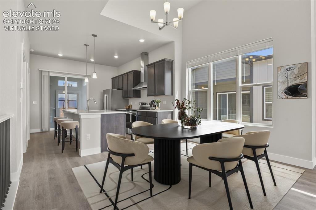 Image 11 of 50: Open floor plan flows easily from kitchen, dining, to great room. Virtually