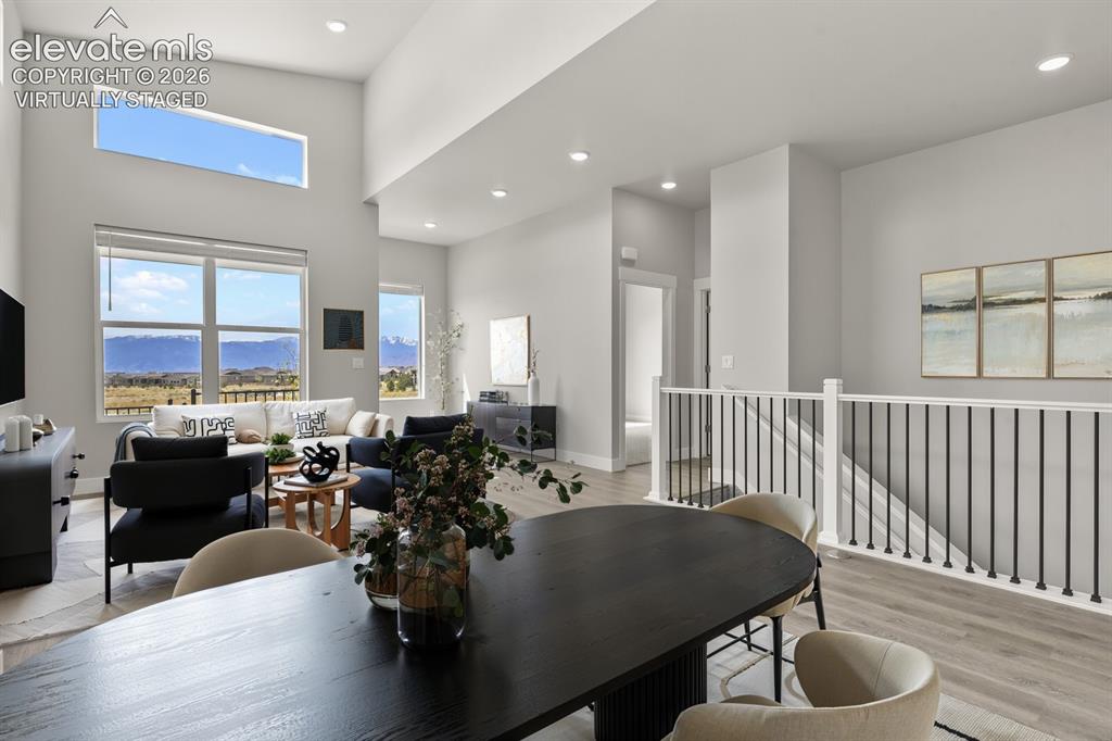 Image 12 of 50: Spacious dining area open to both living and kitchen. Virtually Staged