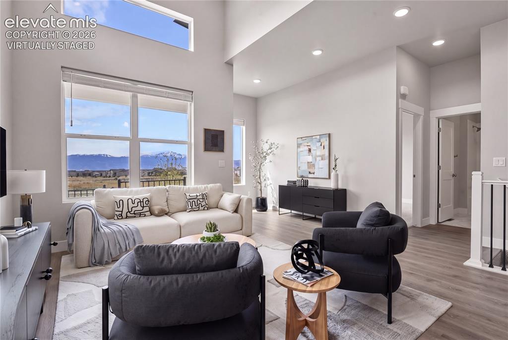 Image 4 of 50: Open great room with high ceilings and natural light throughout. Virtually 