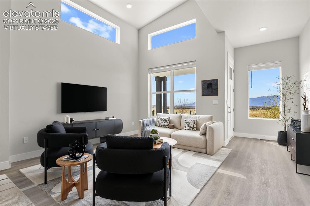 Image 5 of 50: Amazing mountain views from inside the home. Virtually Staged
