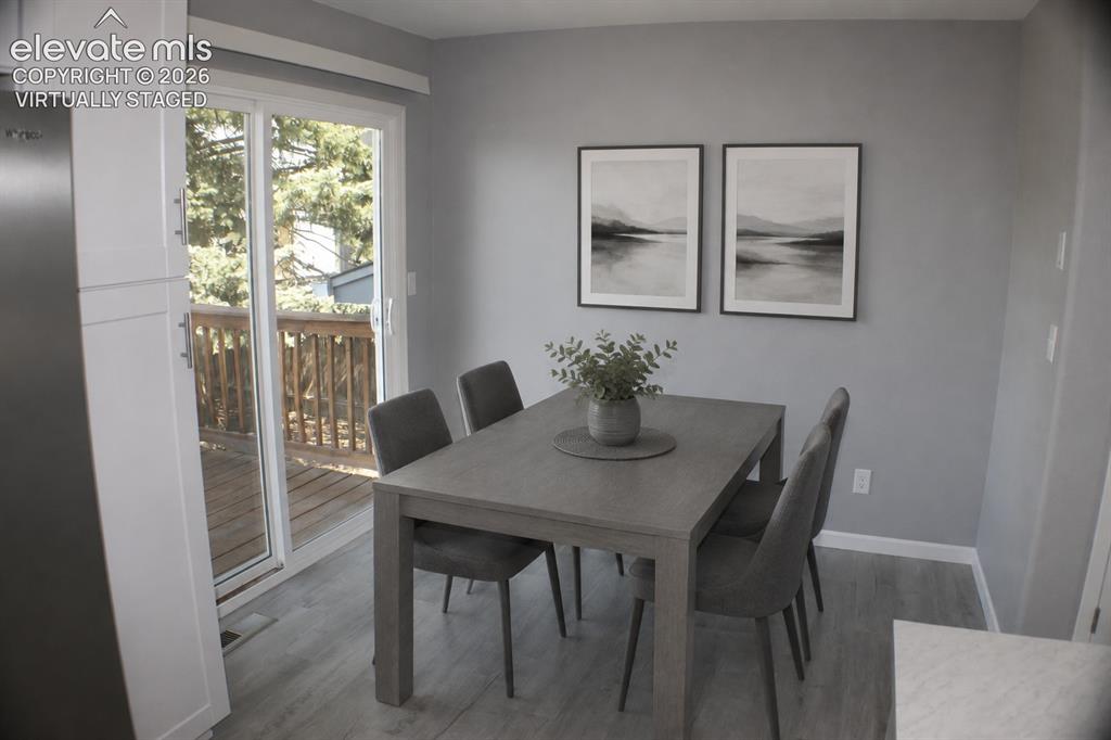 Image 11 of 28: Wood-finish flooring, white built-in cabinetry, sliding virtually staged