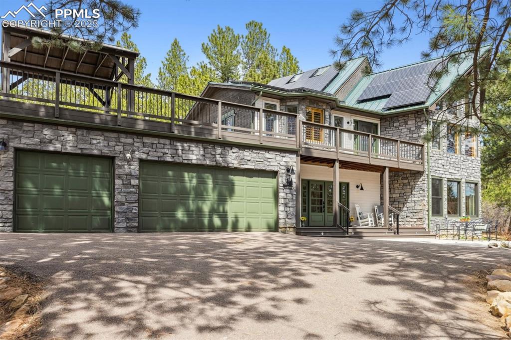 Image 3 of 50: With a paved driveway that guides you to a welcoming circular drive, large
