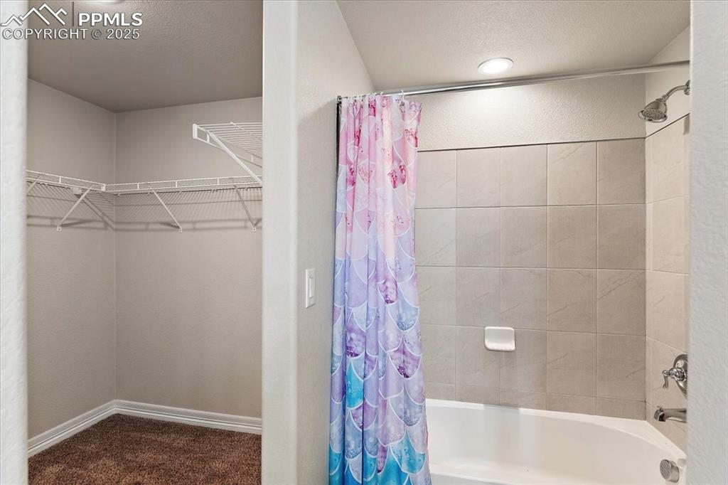 Image 20 of 48: Lower level Primary Suite bathroom #3 and large closet