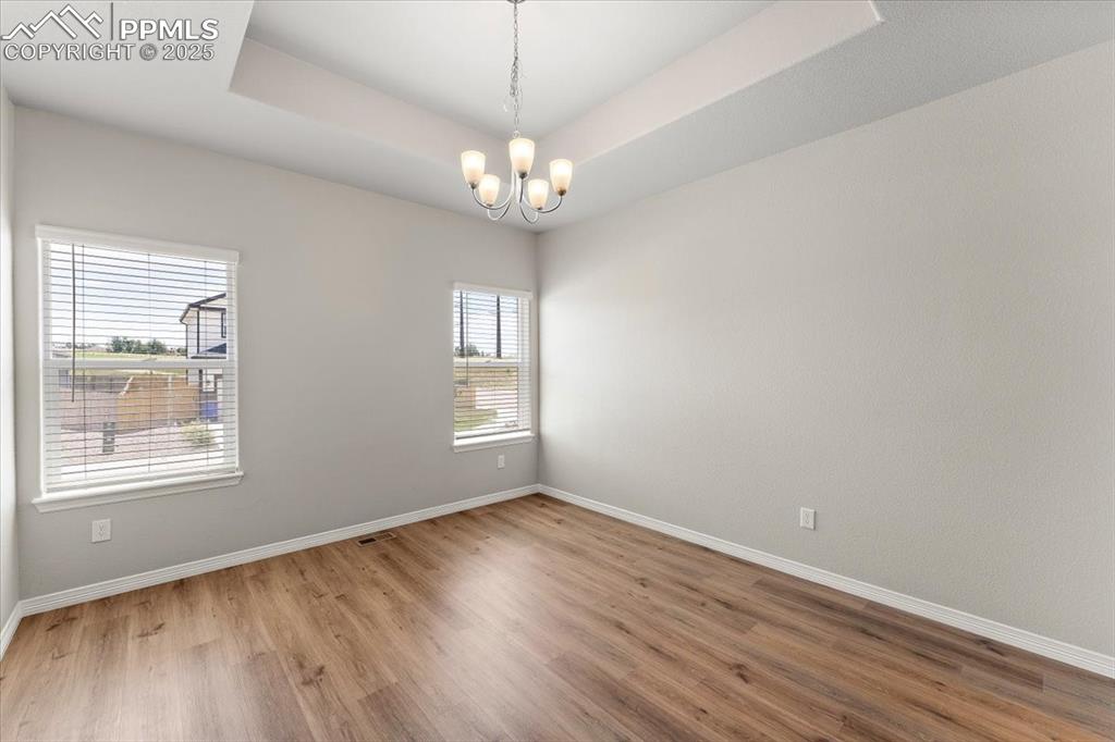 Image 45 of 48: Main level formal dining room, office, flex room