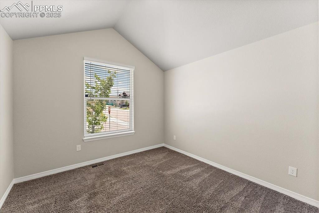 Image 47 of 48: Main level bedroom that is staged as an office