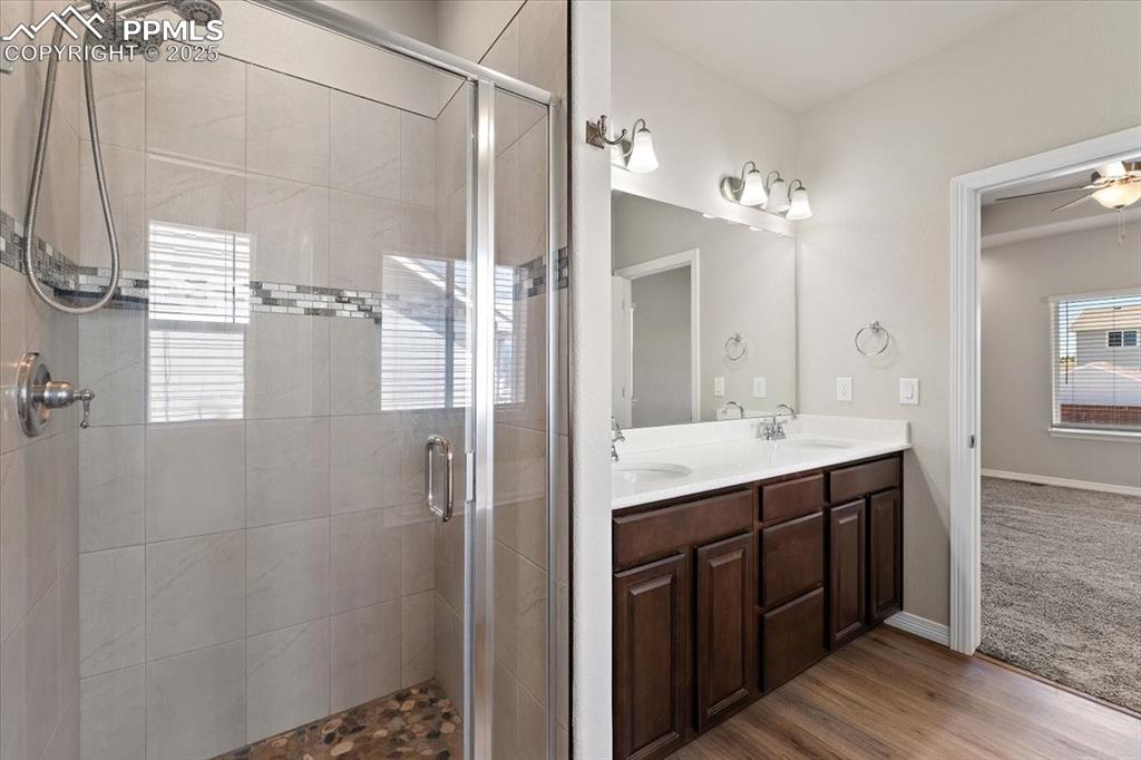 Image 8 of 48: Main level Primary bedroom five-piece bathroom