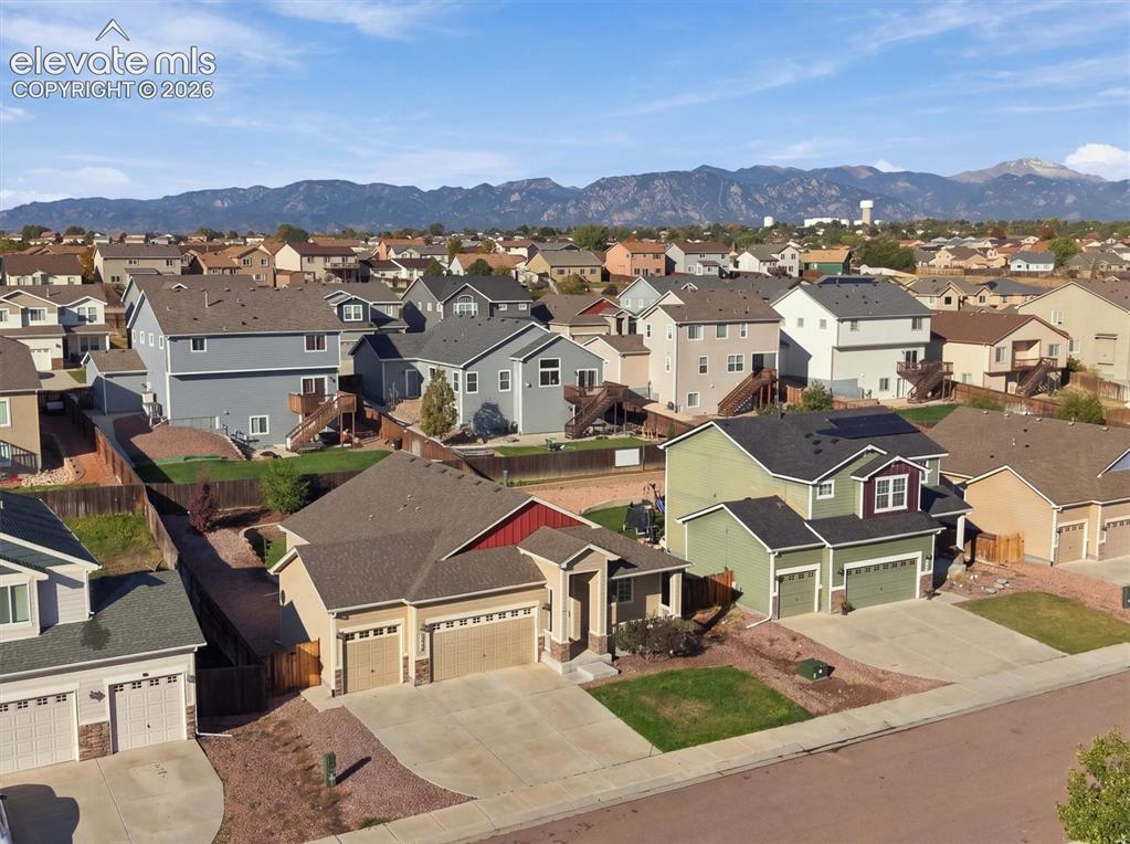 Image 2 of 45: Neighborhood setting featuring residential properties with pitched roofs an