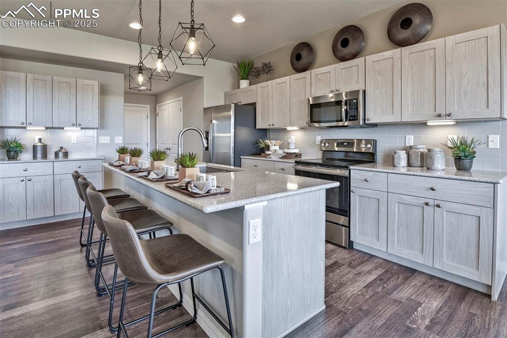 Image 11 of 36: **Photos of previous model home of same floor plan - features will vary