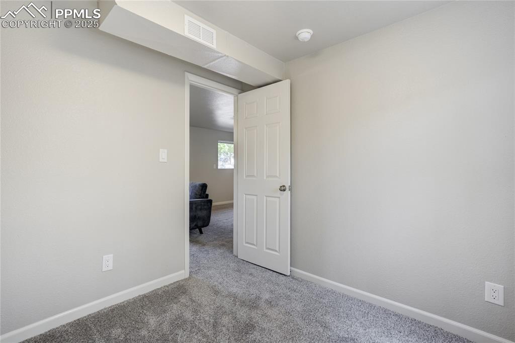Image 26 of 41: Non Conventional Lower Level Bedroom