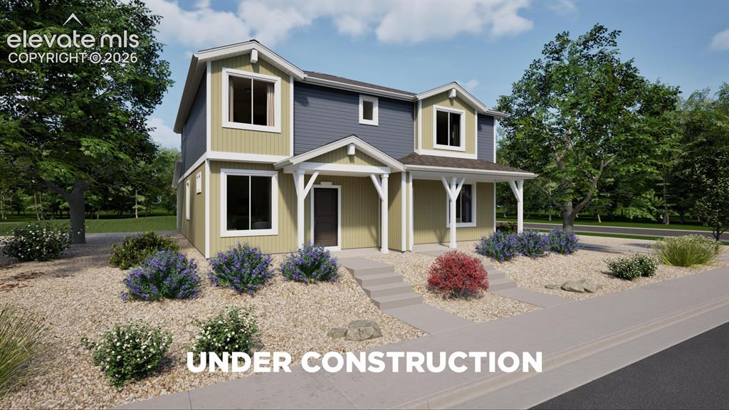 Image 1 of 26: Two-story residence featuring a covered front porch with white columns, two