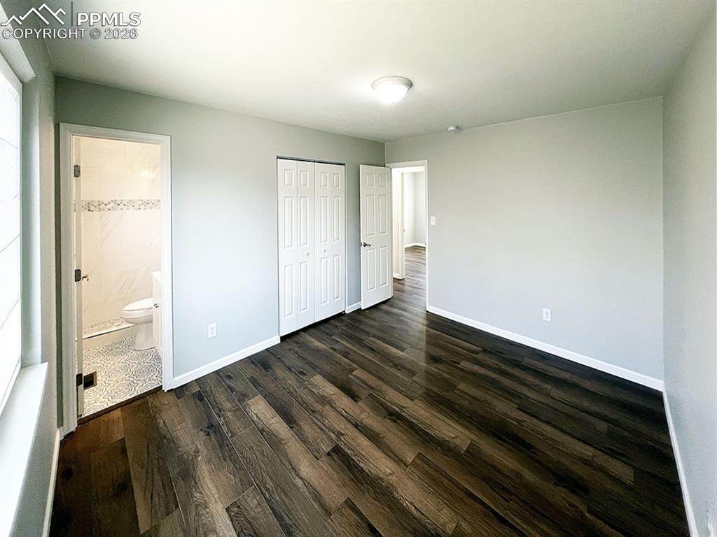 Image 11 of 23: Primary bedroom, with attached 3/4 bathroom