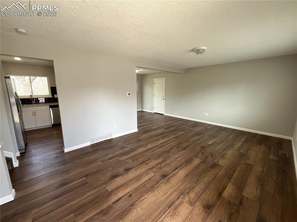 Image 3 of 23: From the entry way, looking into the living room