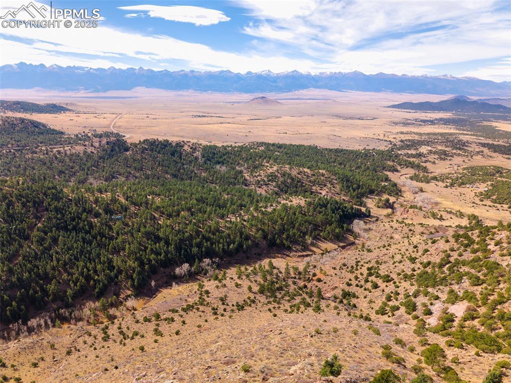 Image 19 of 25: View of mountain backdrop featuring a desert landscape