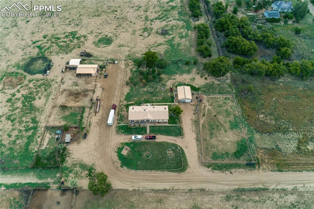 Caption: Aerial view of property and surrounding area with rural landscape